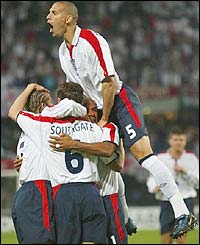 England players celebrate Gareth Southgate's early goal