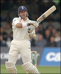 Alec Stewart plays a pull shot