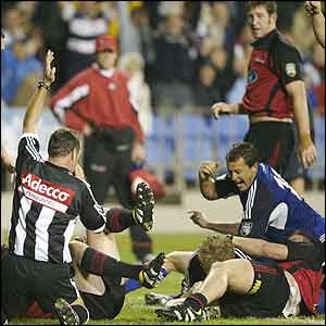 Carlos Spencer celebrates Daniel Braid's try for the Auckland Blues