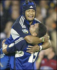 Sam Tuitipou and Mils Miliaina celebrate the Blues' success