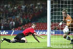Carl Fletcher is swamped by his team-mates after putting Bournemouth ahead once more