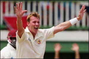 Brett Lee celebrates the first breakthrough for Australia
