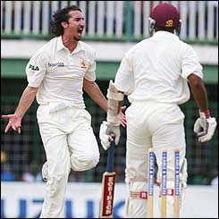 Australia fast bowler Jason Gillespie celebrates the wicket of Darren Ganga