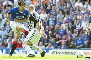 Rangers striker Michael Mols fires his side ahead at Ibrox