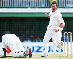 Chanderpaul falls lbw to Andy Bichel on 100