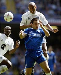 QPR's Clarke Carlisle and Cardiff's Peter Thorne 