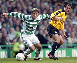 Celtic midfielder Stillian Petrov tries to fend off his marker