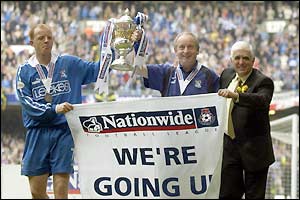 Andy Campbell, Lennie Lawrence and Sam Hammam hold the Division Two trophy aloft