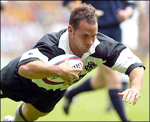 Mark Robinson scores the third try