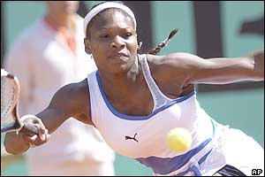 Serena Williams stretches for a return