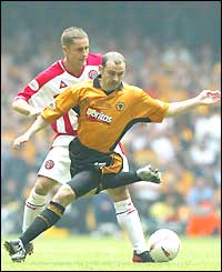 Wolves' Colin Cameron holds off Sheffield United's Michael Brown