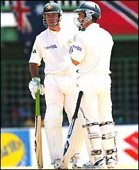Ponting and Langer chat in the middle of the wicket during their 248-run partnership