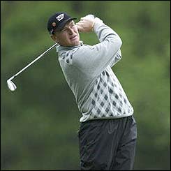 South Africa's Ernie Els drives at the 12th hole