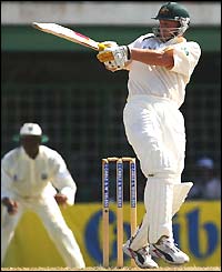 Australian wicketkeeper Adam Gilchrist hits out during his innings of 77