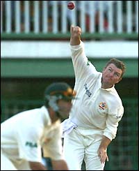 Spinner Stuart MacGill bowls for Australia in the West Indian second innings