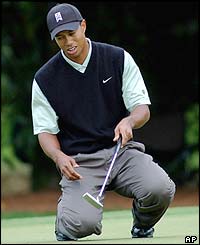 Tiger Woods shows his frustration after missing a putt at the 11th green