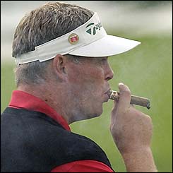 Darren Clarke smokes a cigar 