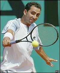 Spain's Albert Costa hits a backhand