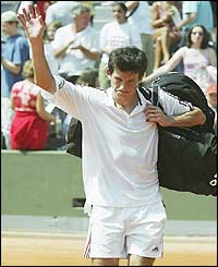 Tim Henman waves to the crowd