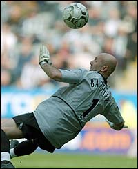 Fabien Barthez cannot prevent Shola Ameobi scoring Newcastle's second