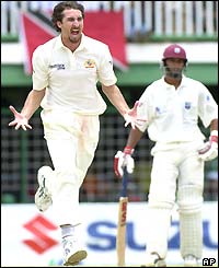 Jason Gillespie of Australia roars with delight after dismissing Devon Smith