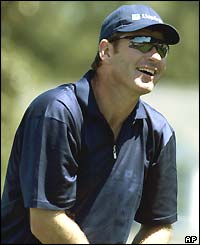 Nick Faldo grimaces as a shot goes awry early in his third round