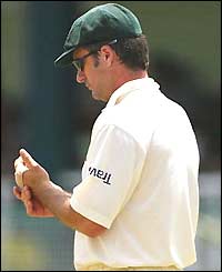 Australian captain Steve Waugh holds his strapped left hand after needing six stitches