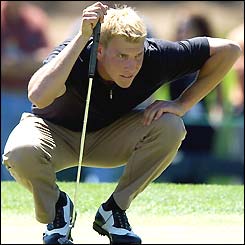 American amateur champion Ricky Barnes crouches to judge a putt during his third round