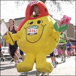 A racer dressed up as Mr Happy takes part in the London marathon