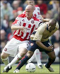 Robert Page challenges Arsenal's Sylvain Wiltord