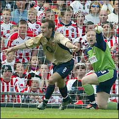 Freddie Ljungberg reels away after opening the scoring