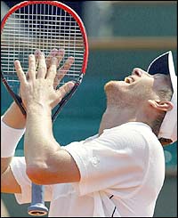 Kafelnikov shouts after missing a shot