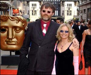A bearded Paul Merton, with partner Sarah Parkinson, had complained he never wins Baftas