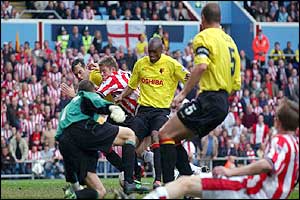Southampton's James Beattie slides as Watford's Paul Robinson scores an own goal