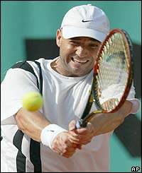Agassi plays a forehand return to Ancic