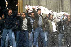 Police spray water on workers from the Justice Palace