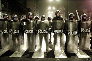 Anti-riot policemen stand guard near the Congress in Lima 