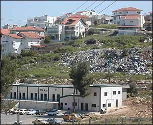 Palestinian school abutting Shareh Tikva, with the settlement's rubbish tip between them