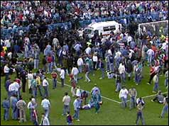 Liverpool football fans try to help those being crushed at Hillsborough
