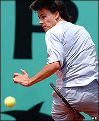 Argentina's Guillermo Coria returns the ball to his Hungarian opponent Attila Savolt