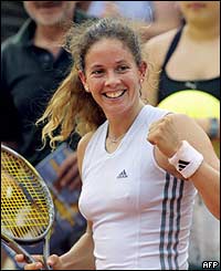 Switzerland's Patty Schnyder jubilates after she defeated her Greek opponent Eleni Daniilidou