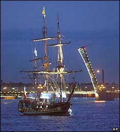 A replica of Peter the Great's sailing vessel Standart sails past the opened Troitsky bridge on the Neva river in St Petersburg early Friday