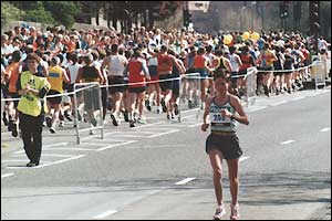 A single female runner heads the other way the male competitiors after 13/21miles at Wapping 