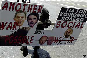 Dog holds anti-war banner