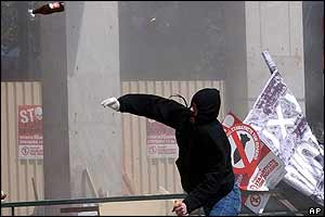 Protester throwing bottle