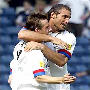 Lorenzo Amoruso celebrates his goal with Neil McCann