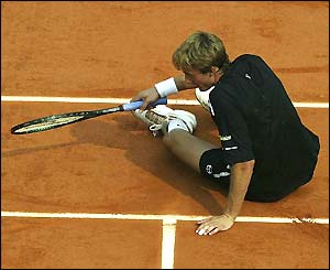 Juan Carlos Ferrero looks upset as he as he loses the first set 6-4