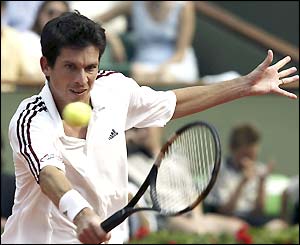 Tim Henman plays a backhand volley