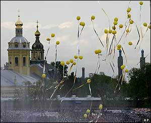 Balloons fly over spectators during a show in St Petersburg 31 May 2003