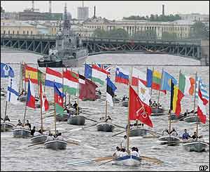 Rowing boats carry flags of countries participating in the 300th anniversary celebrations 31 May 2003